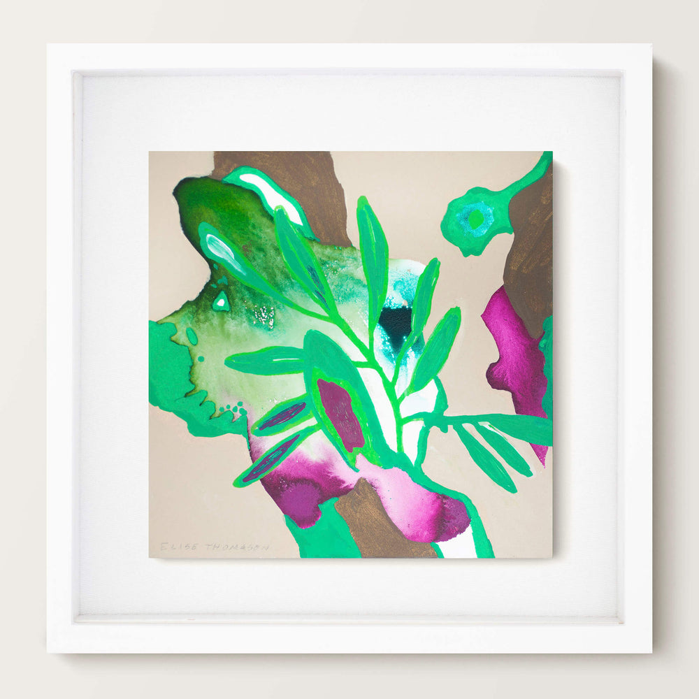 green and pink abstract art in white frame