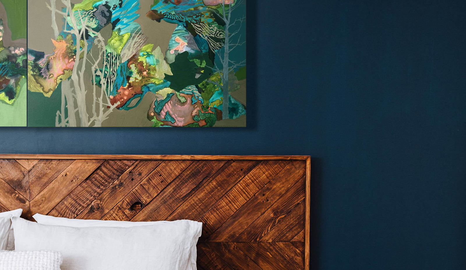 diptych abstract paintings over wooden bed 