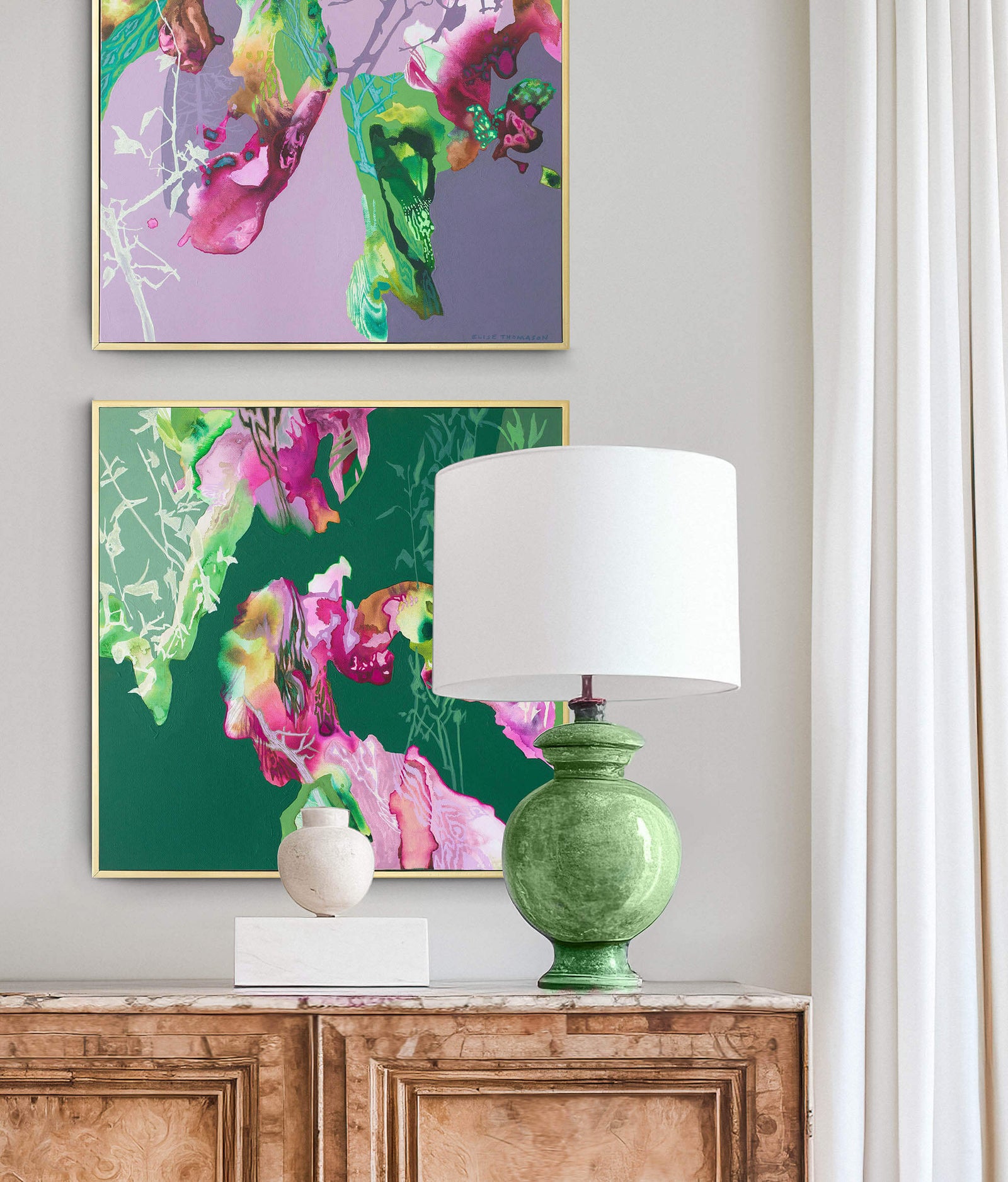 pair of colorful abstract paintings with chest of drawers