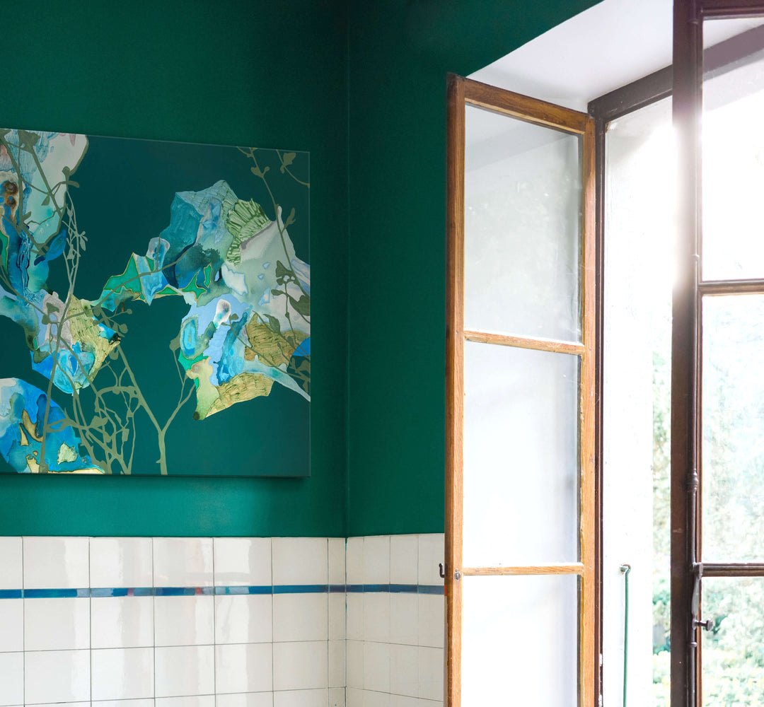 deep green abstract landscape art in bathroom